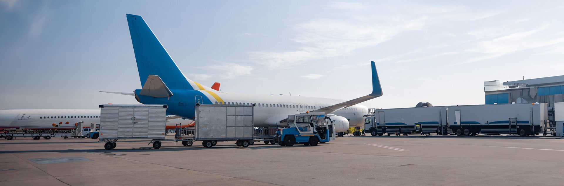 airfield-tractors-near-big-modern-airplane-ready-f-2023-11-27-05-27-47-utc